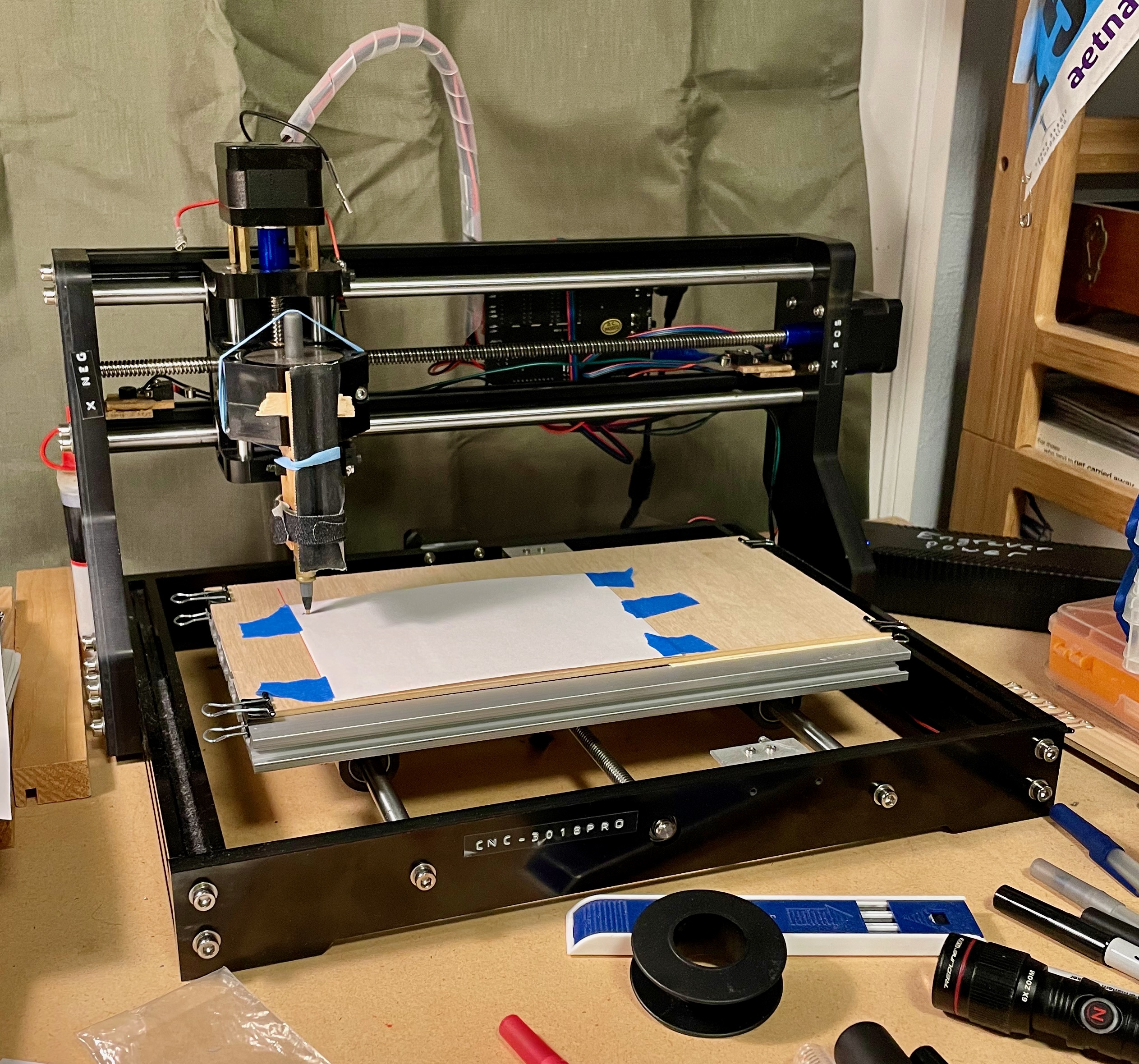 CNC Engraving Machine with a pen holder in place of the spindle.